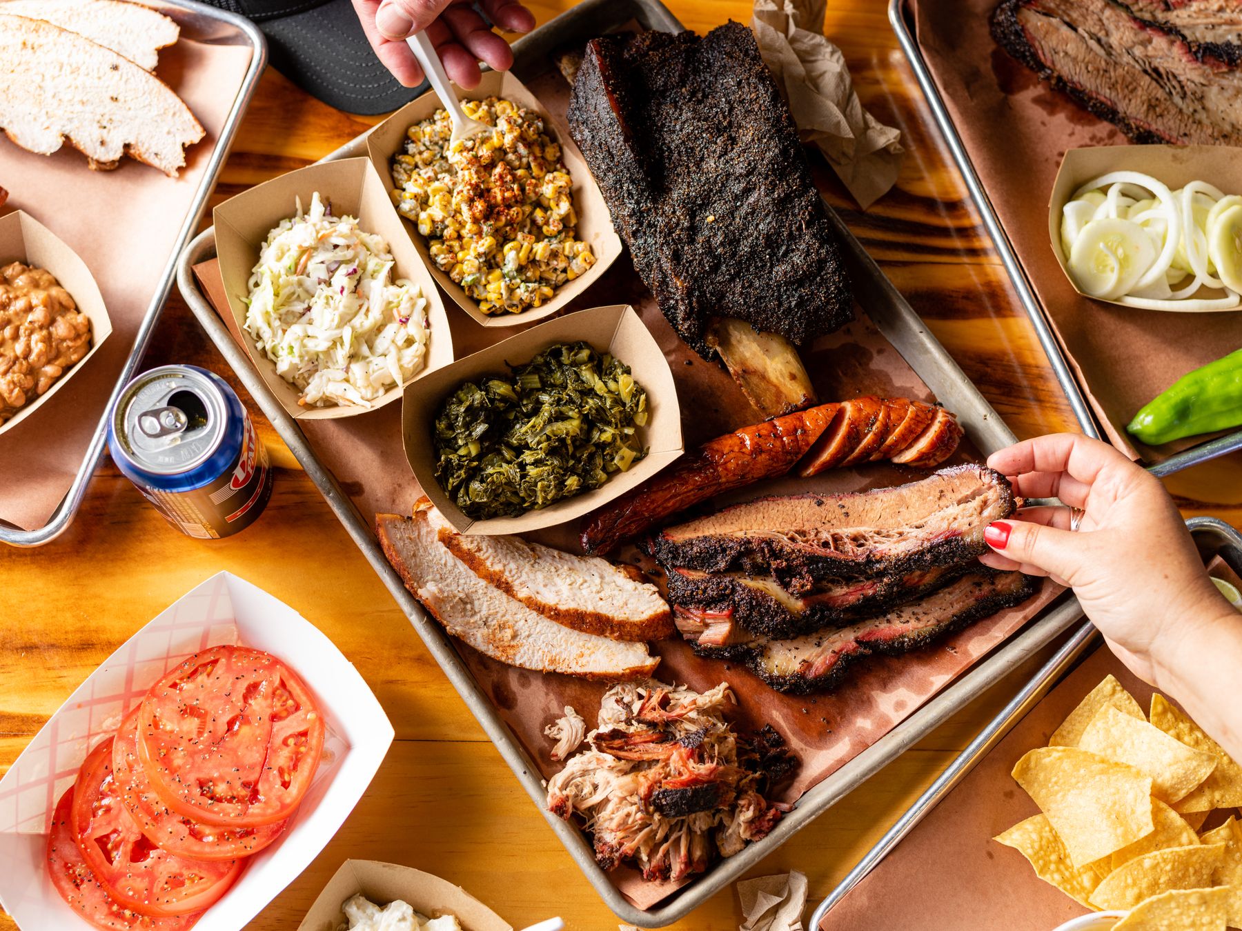 Overhead spread of smoked meats and sides