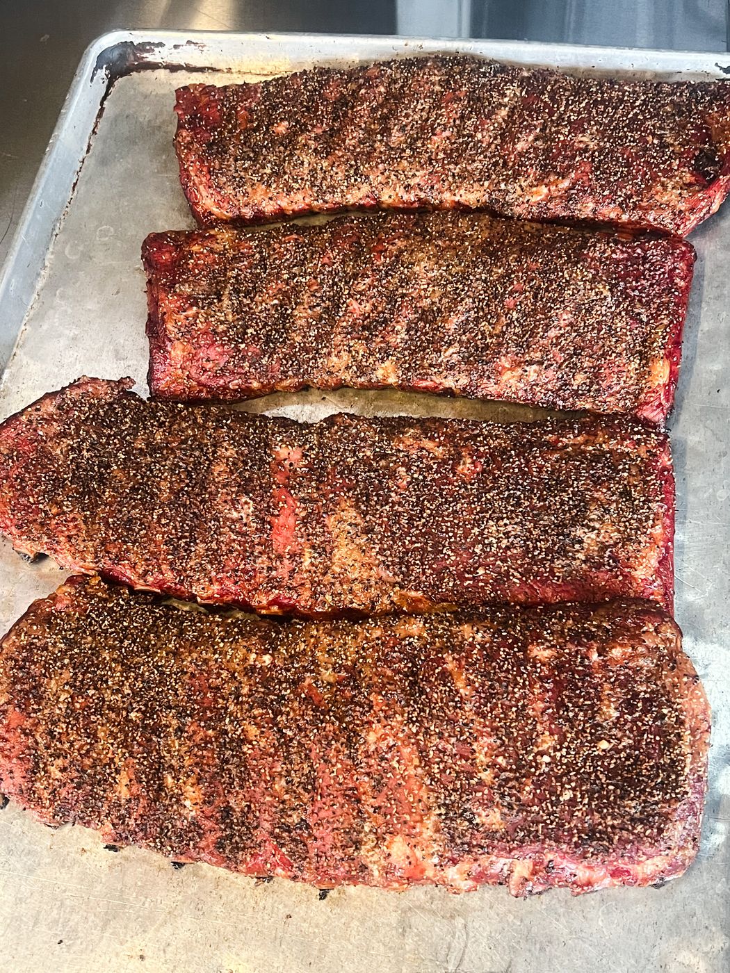 Rack of smoked St. Louis pork ribs